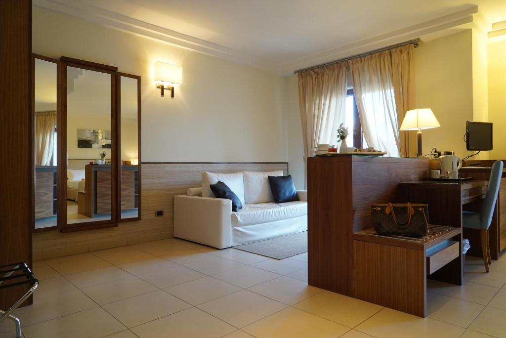Postel nebo postele na pokoji v ubytování Suites & Residence Hotel