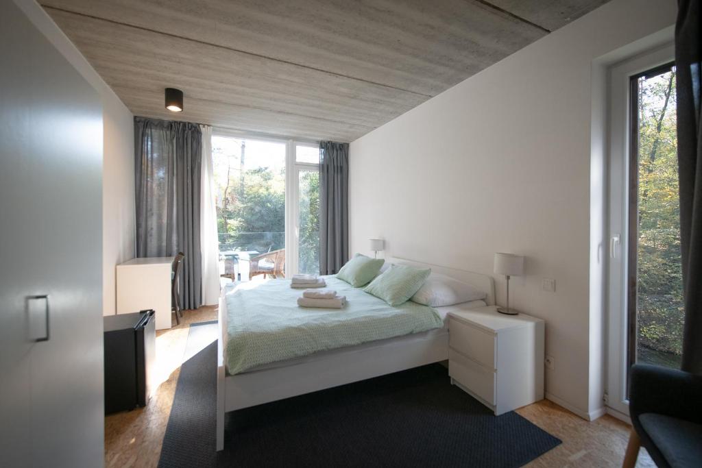 Llit o llits en una habitació de Penzion Kůlna