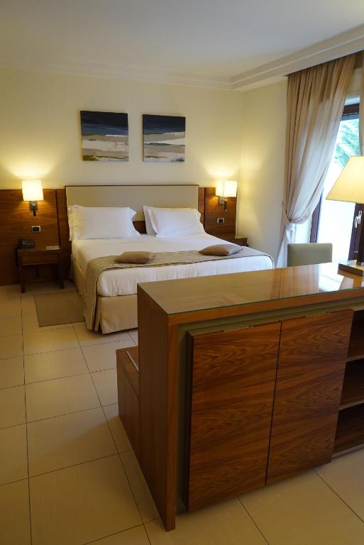 Postel nebo postele na pokoji v ubytování Suites & Residence Hotel