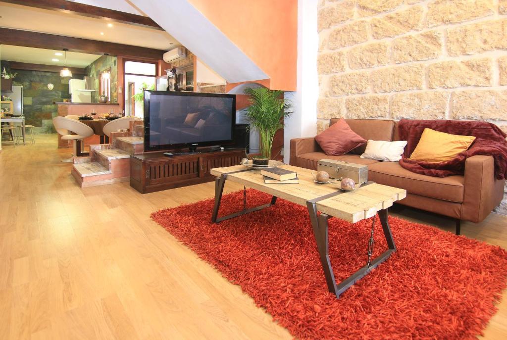 TV a/nebo společenská místnost v ubytování Casa Marrón Boutique Home