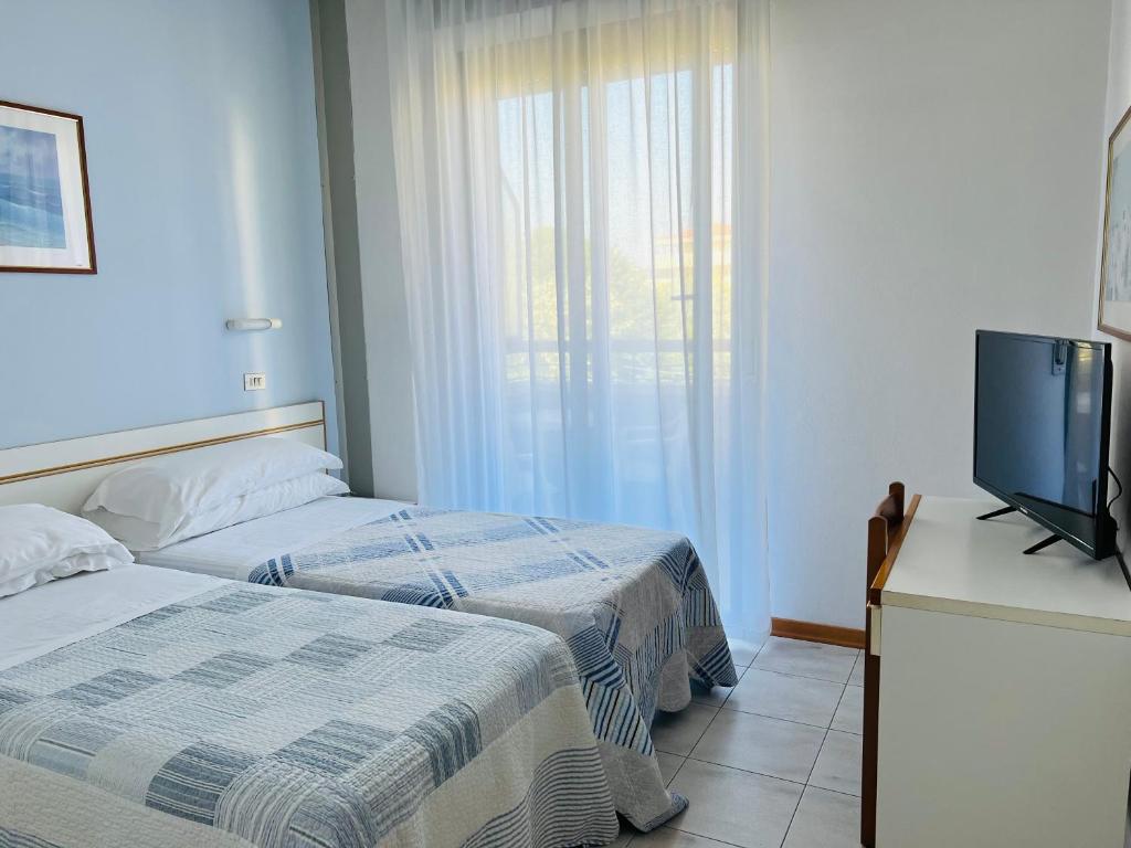 Postel nebo postele na pokoji v ubytování Hotel Betty Personal Style and Beach Village