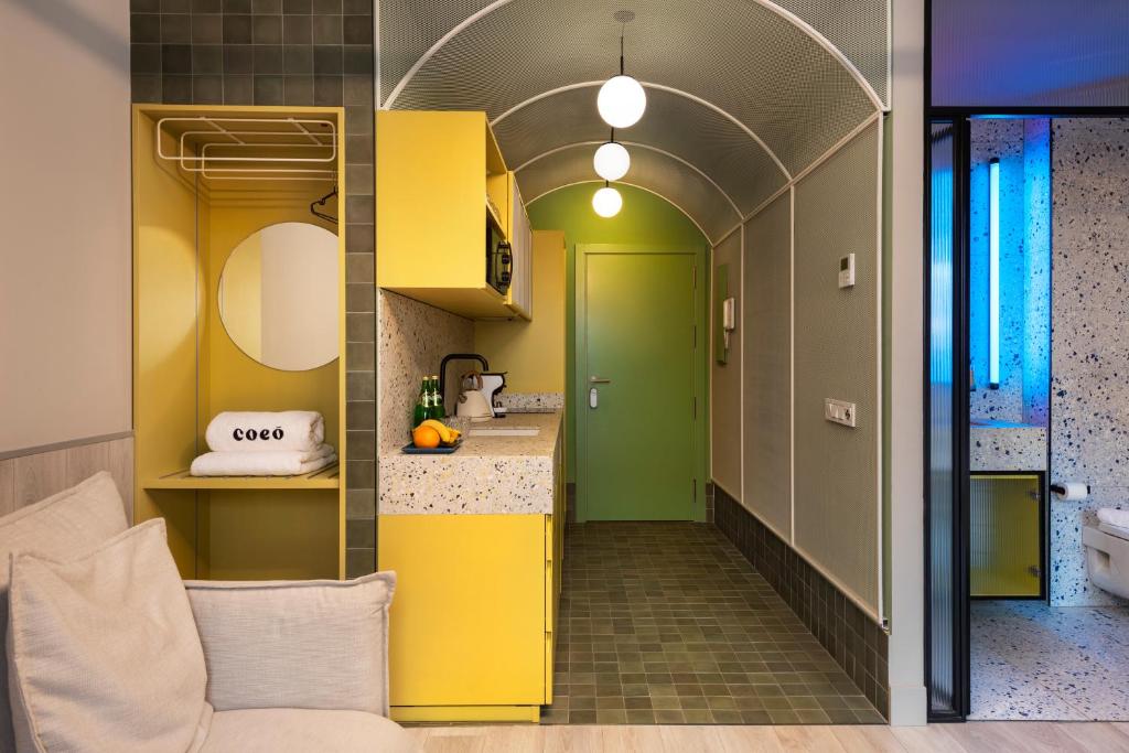 A kitchen or kitchenette at Coeo Peña Design Apartments