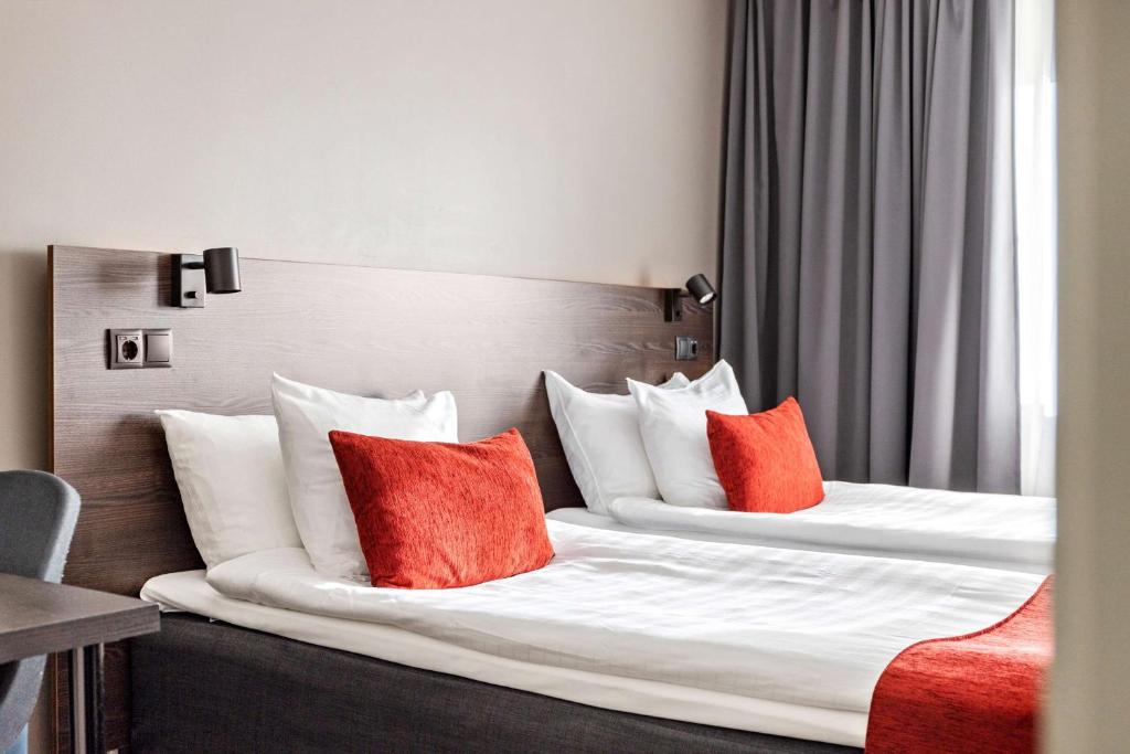 Postel nebo postele na pokoji v ubytování Best Western Hotel Savoy