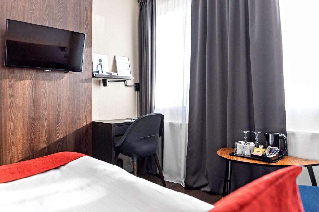 Postel nebo postele na pokoji v ubytování Best Western Hotel Savoy