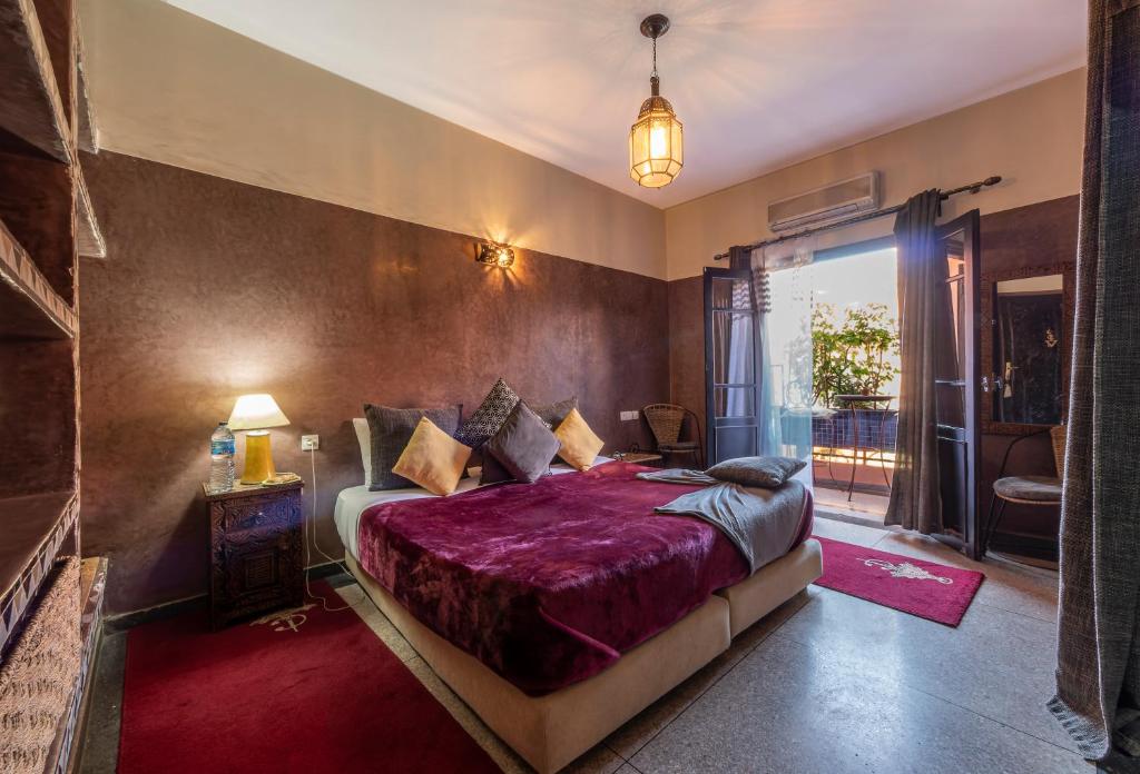 Postel nebo postele na pokoji v ubytování Villa Soraya Hammam & Jacuzzi