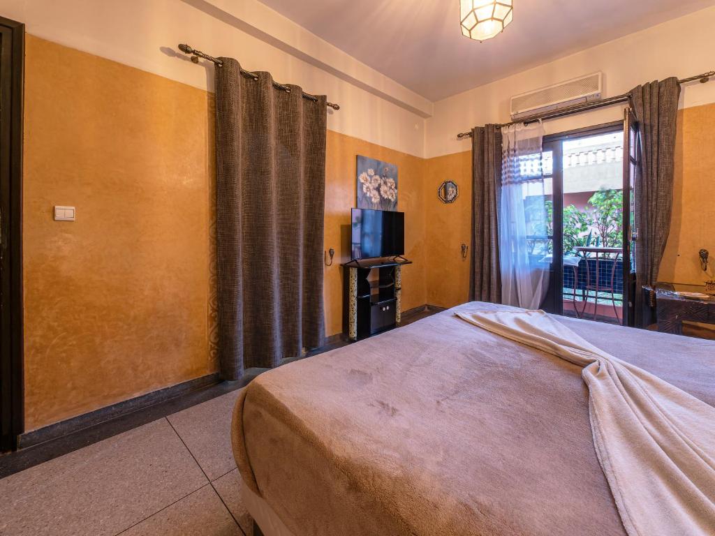 Postel nebo postele na pokoji v ubytování Villa Soraya Hammam & Jacuzzi