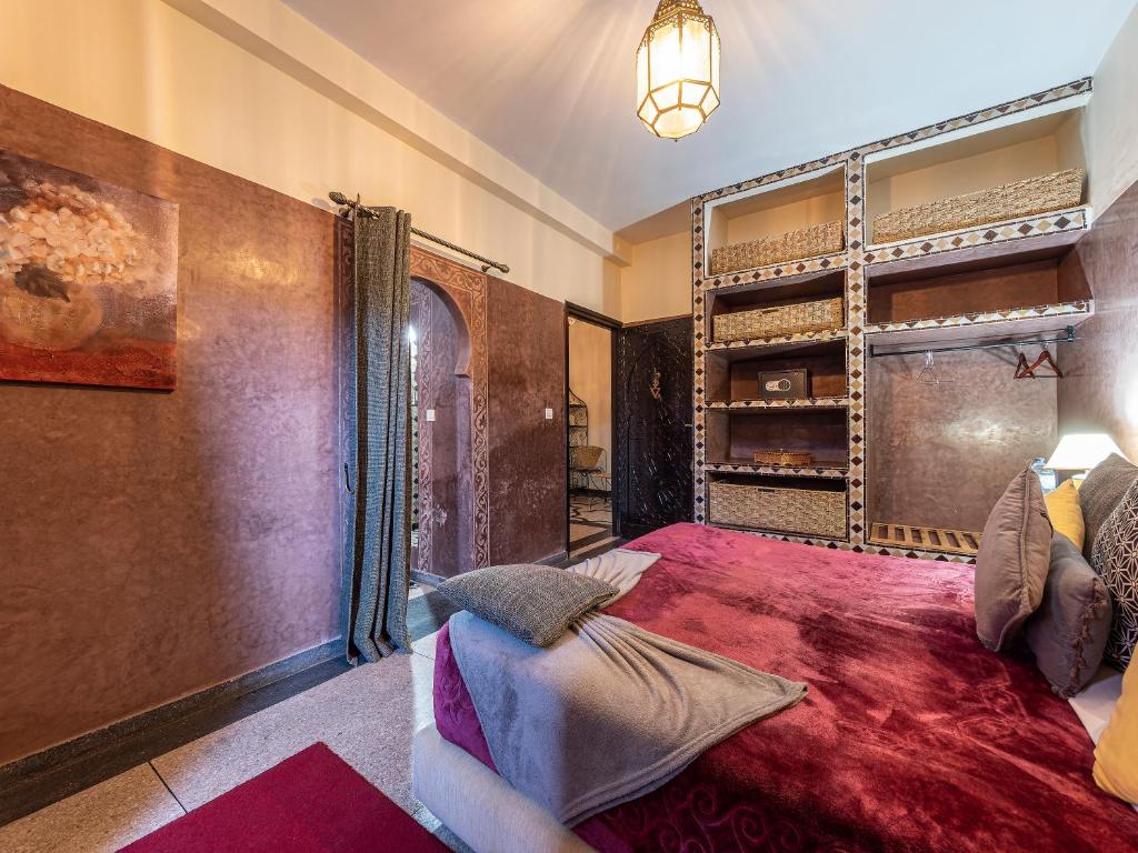Postel nebo postele na pokoji v ubytování Villa Soraya Hammam & Jacuzzi