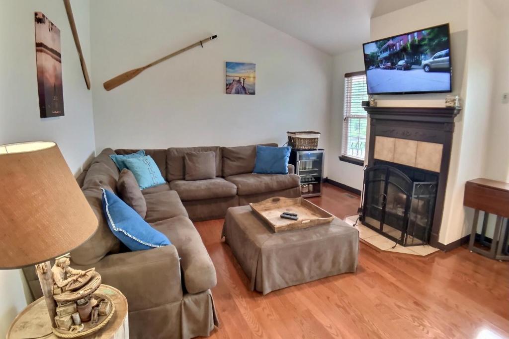 a living room with a couch and a fireplace at Hideaway Harbor in Holiday Island