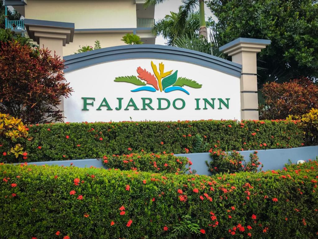 a sign at the entrance to a facienda inn at Fajardo Inn Resort in Fajardo