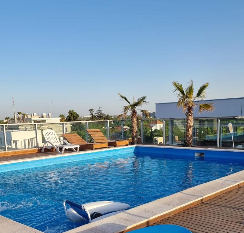 a swimming pool with a whale chilling in the water at UBICACION PERFECTA Y CONFORT- 5TA SECCION in Mendoza
