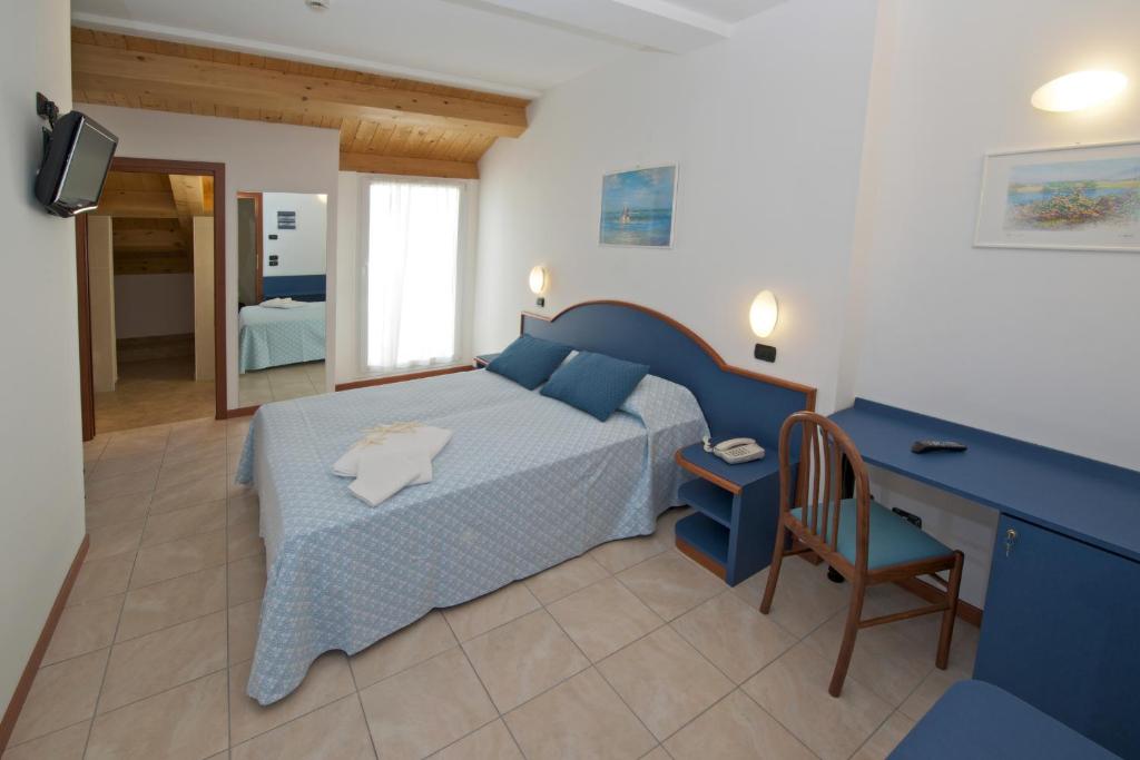 Łóżko lub łóżka w pokoju w obiekcie Hotel Torretta