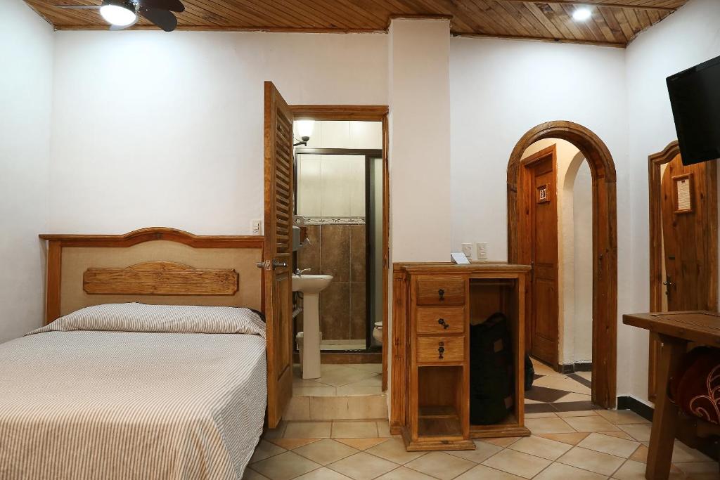 Postel nebo postele na pokoji v ubytování Meson de Juan Valle