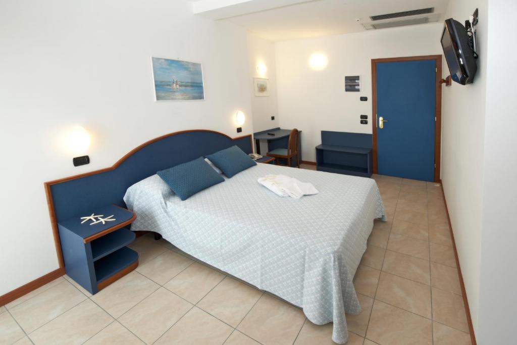 Łóżko lub łóżka w pokoju w obiekcie Hotel Torretta