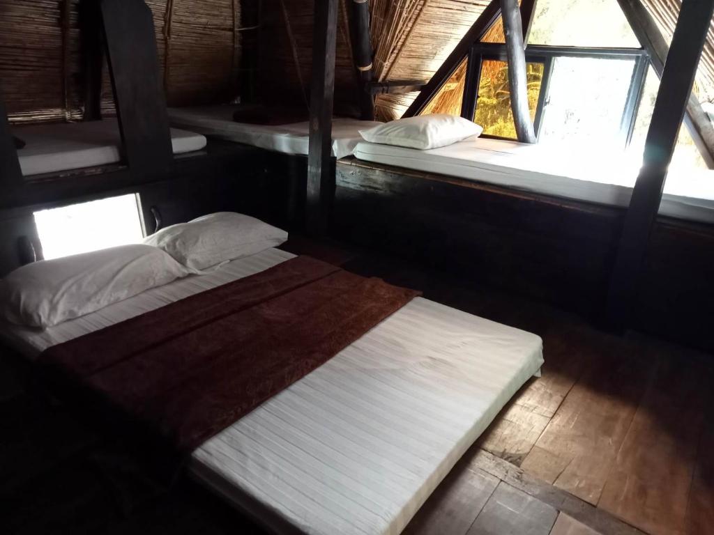 Postel nebo postele na pokoji v ubytování Rice Homestay