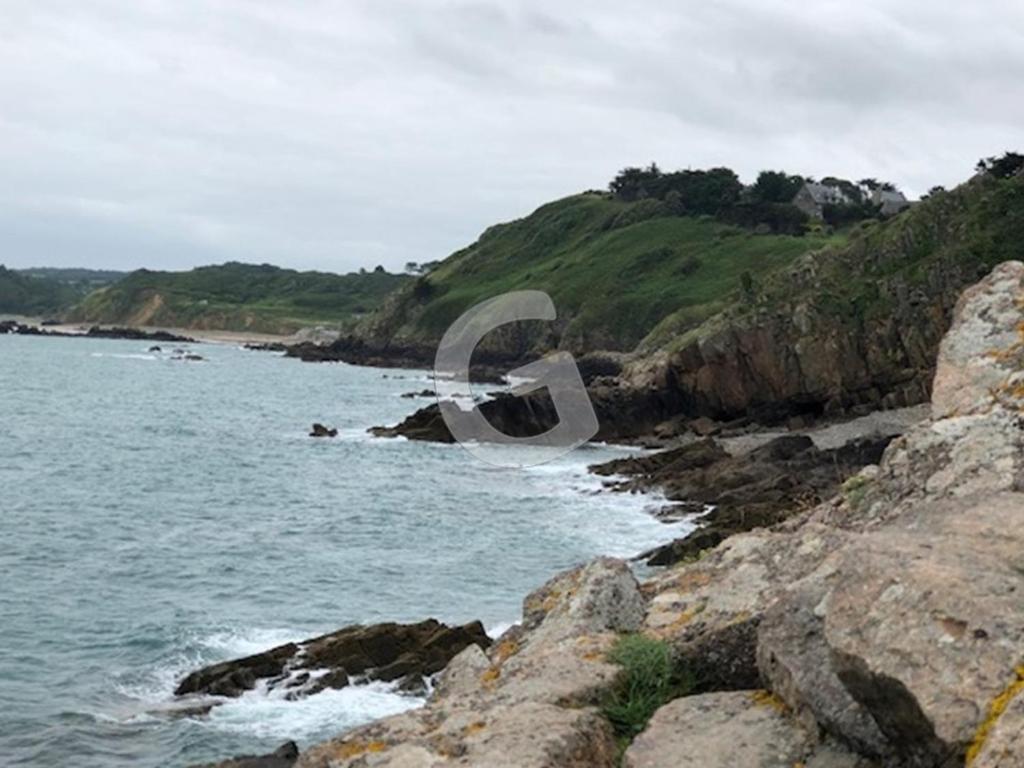 a view of a beach with the ocean and rocks at Maison Le Bernard, 5 pièces, 6 personnes - FR-1-357-253 in Le Bernard