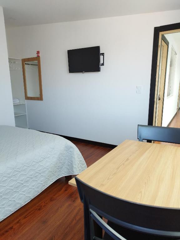 TV a/nebo společenská místnost v ubytování Habitaciones Alkimya