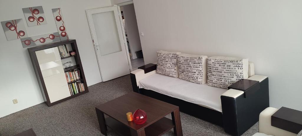 a living room with a couch and a table at Apartmán u Jána in Ružomberok
