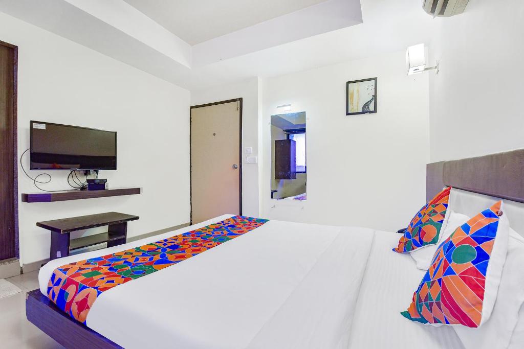 Postel nebo postele na pokoji v ubytování FabHotel Skyland