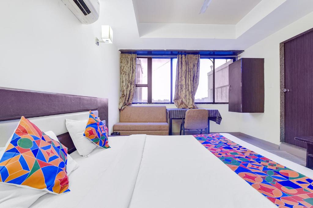 Postel nebo postele na pokoji v ubytování FabHotel Skyland