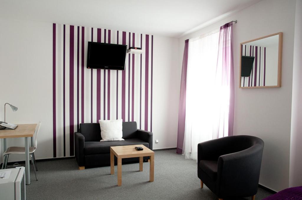 TV a/nebo společenská místnost v ubytování Hotel Berger