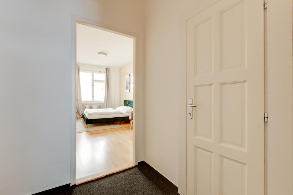 Łóżko lub łóżka w pokoju w obiekcie Riben House Prague