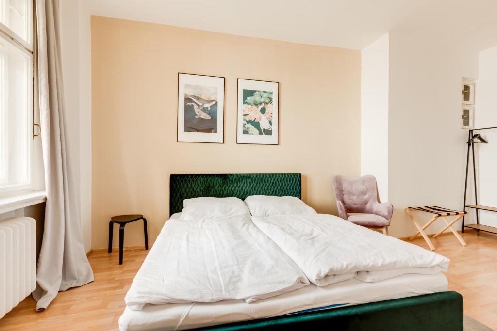 Łóżko lub łóżka w pokoju w obiekcie Riben House Prague