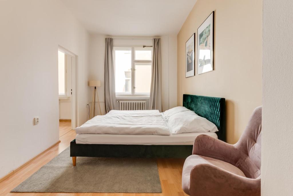 Łóżko lub łóżka w pokoju w obiekcie Riben House Prague