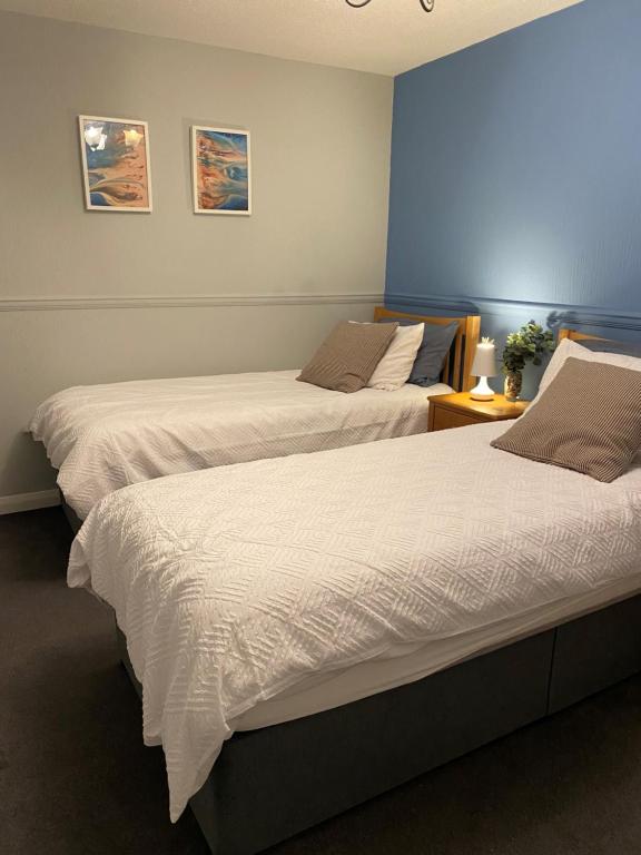 En eller flere senge i et værelse på Ploughmans Cottage, St Florence, Tenby