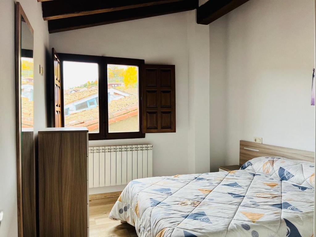Postel nebo postele na pokoji v ubytování Apartamentos Raíces