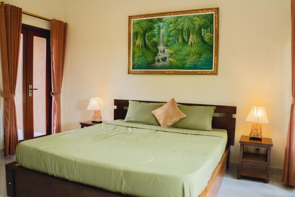 Postel nebo postele na pokoji v ubytování Mancur Guesthouse