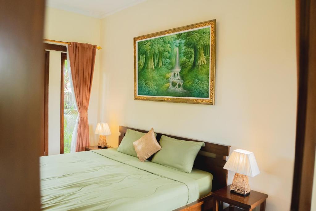 Postel nebo postele na pokoji v ubytování Mancur Guesthouse