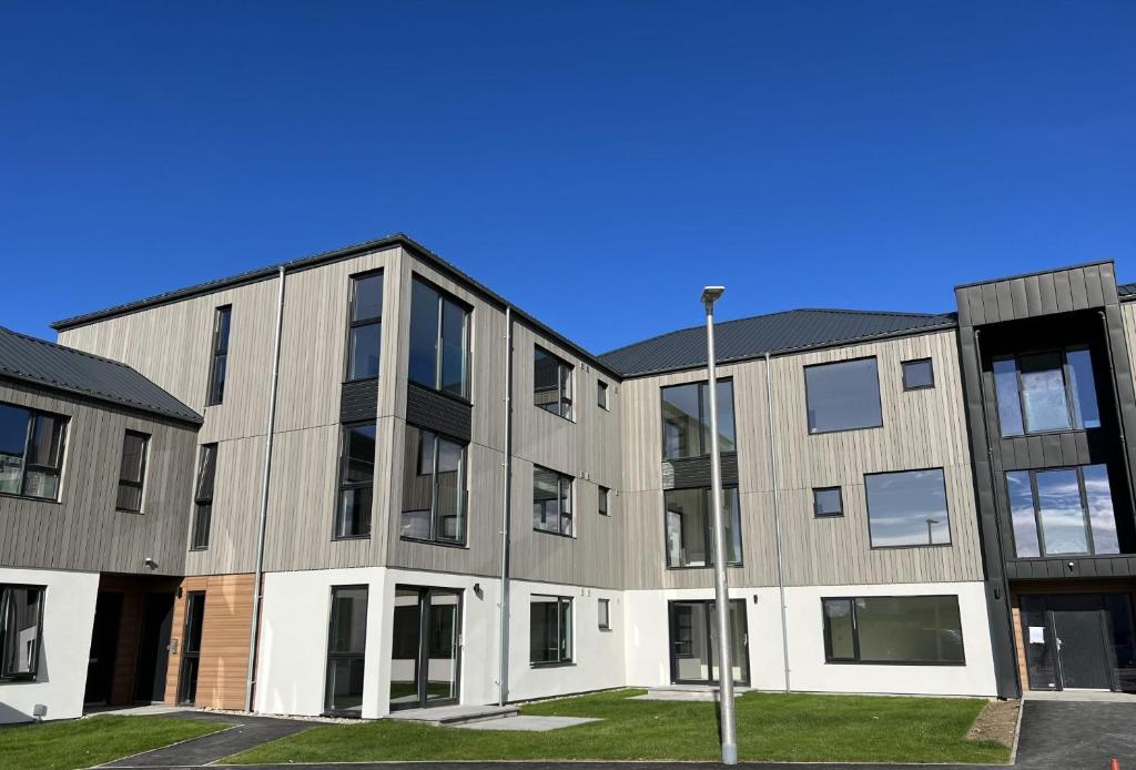 an exterior view of an apartment building at Caledonia Place in Aviemore