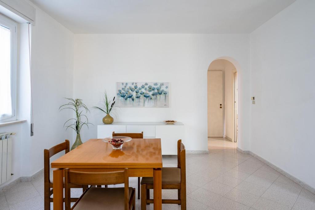 a dining room with a wooden table and chairs at Vallevo 42 - YourPlace Abruzzo in San Vito Chietino