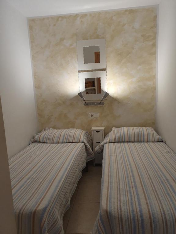 Postel nebo postele na pokoji v ubytování Apartaments Les Roques