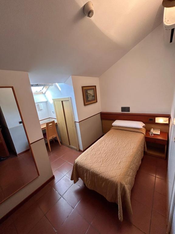 Postel nebo postele na pokoji v ubytování Hotel Aspromonte