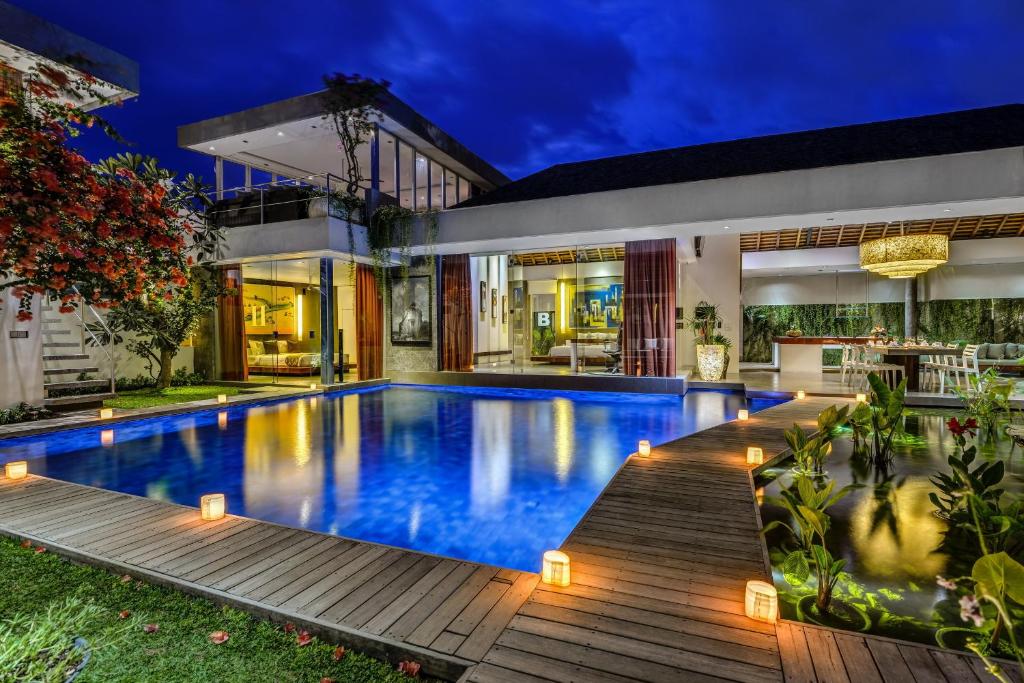 a swimming pool in the backyard of a house at Villa Banyu in Seminyak