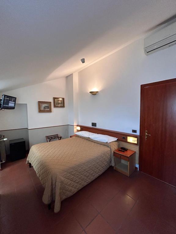 Postel nebo postele na pokoji v ubytování Hotel Aspromonte