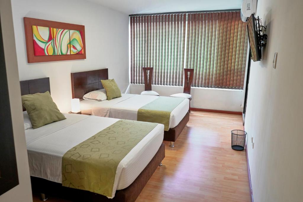 Cama o camas de una habitación en Hotel Volare