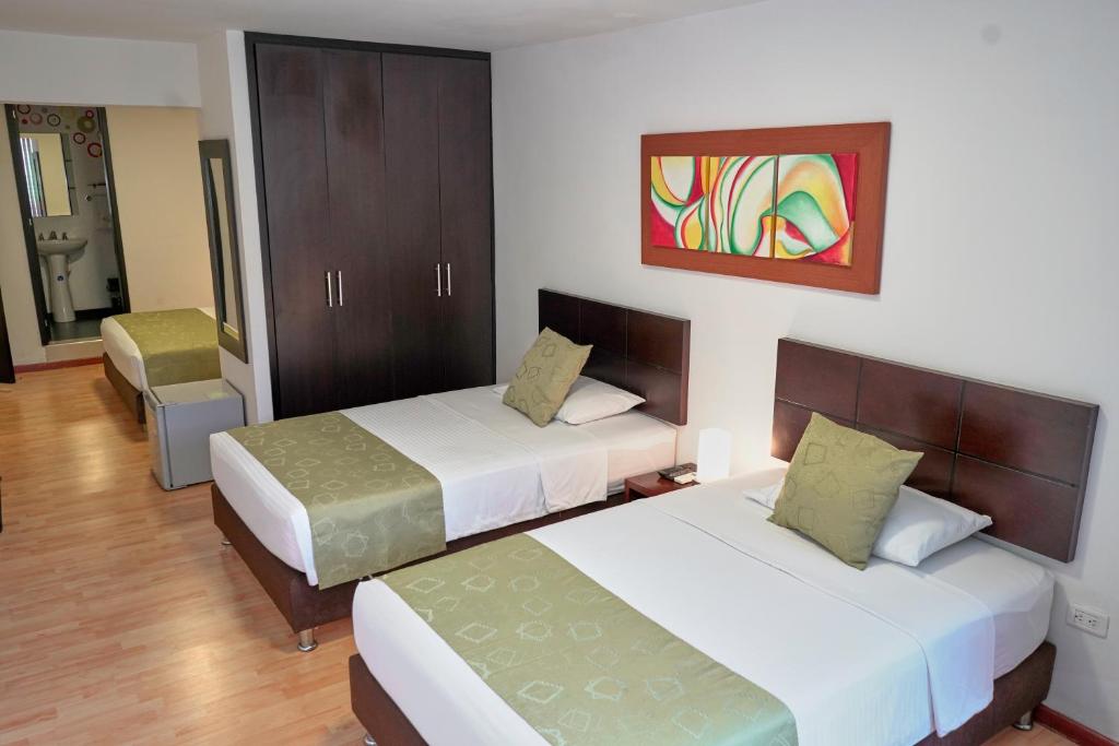 Cama o camas de una habitación en Hotel Volare