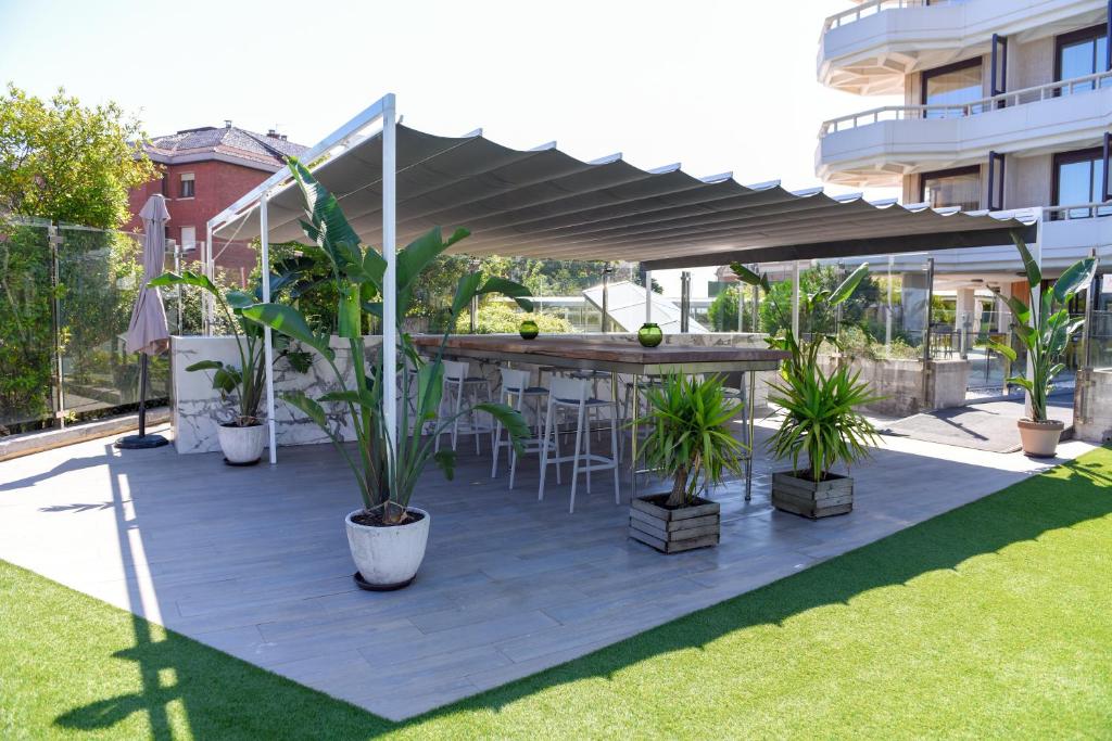 A garden outside Gran Hotel Victoria