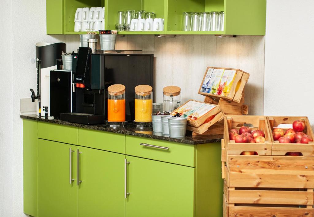 Kuchyň nebo kuchyňský kout v ubytování Tailormade Hotel IDEA Spreitenbach