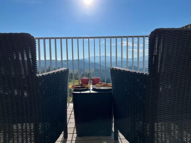 a balcony with a table and a view of the mountains at Apartmán Kubínska 33 in Dolný Kubín