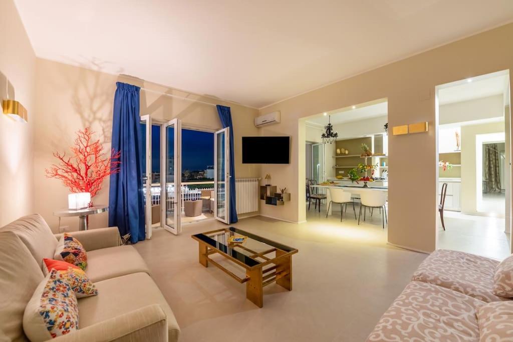 a living room with a couch and a table at Charming luxury apartment: Sorrento center in Sorrento