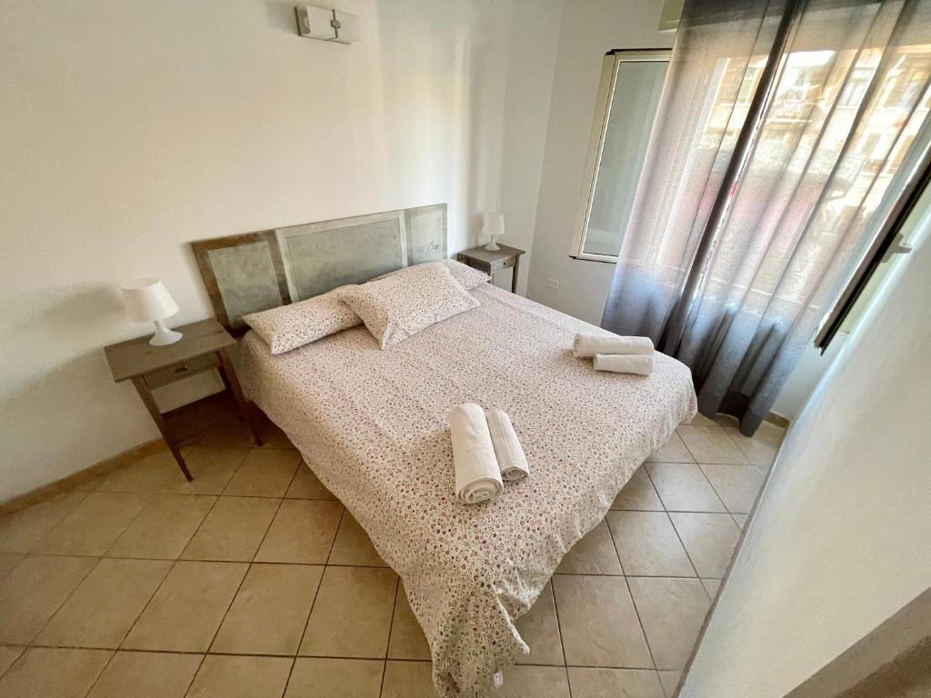 Postel nebo postele na pokoji v ubytování Borgo Antico Apartments