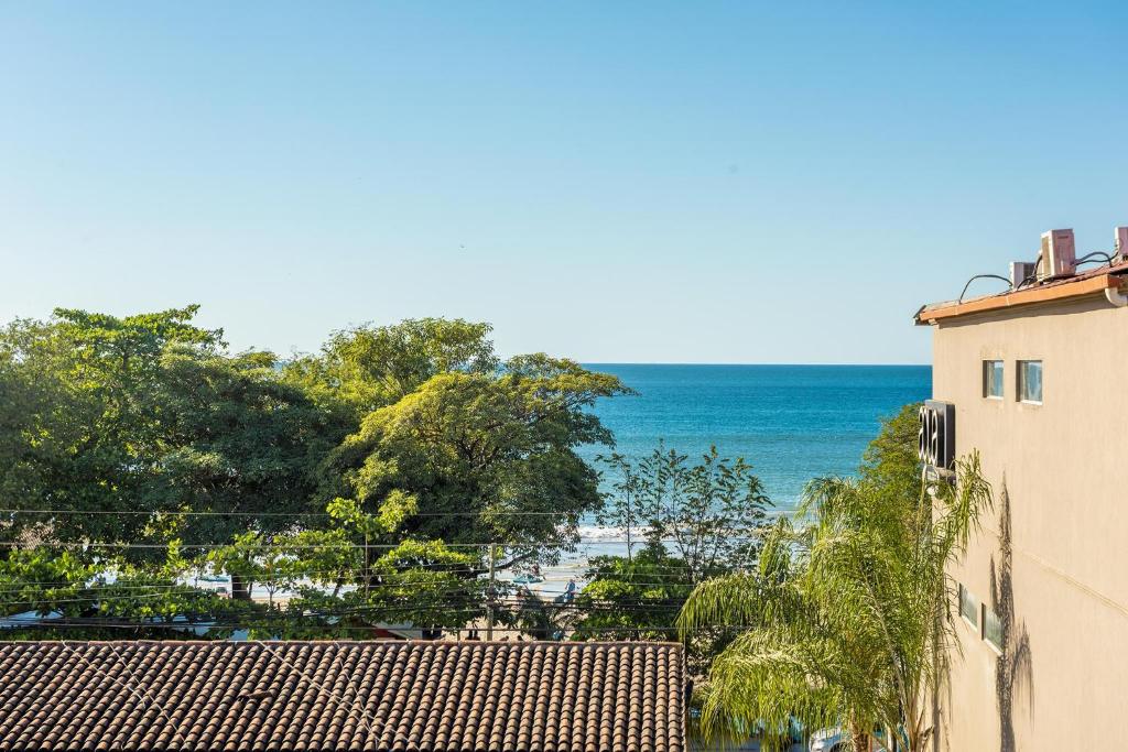 a view of the ocean from a building at Sunrise 43 - 2 Bedroom Ocean View Condo in Tamarindo