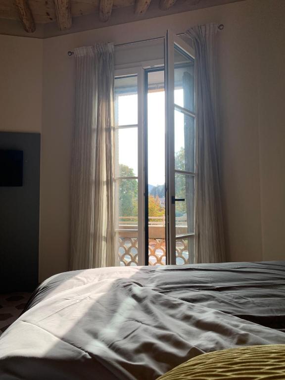 Postel nebo postele na pokoji v ubytování Palazzo Fritz