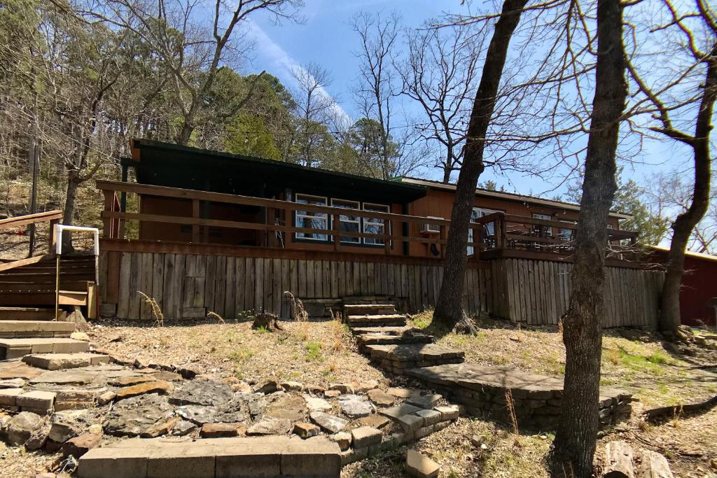 a large wooden house in the woods at Ozark Rambler Cabin in Eureka Springs