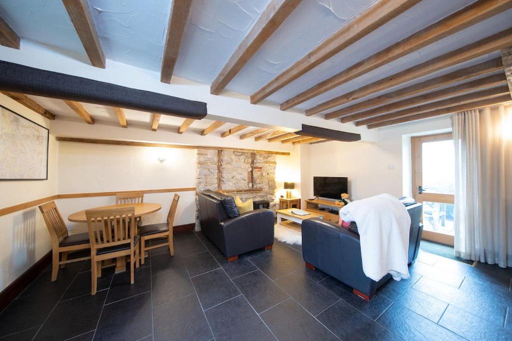 TV a/nebo společenská místnost v ubytování Lomas Cottage