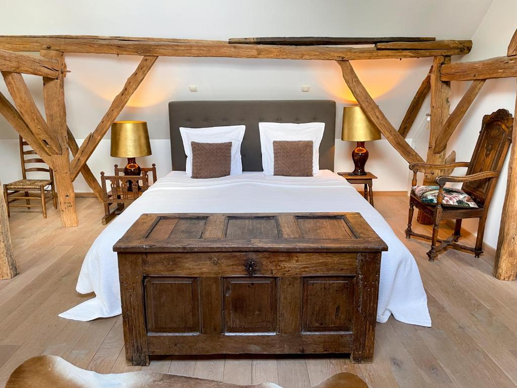 Postel nebo postele na pokoji v ubytování B&B De Paenhoeve