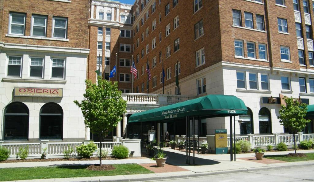 a building with a green awning on a city street at Knickerbocker on the Lake in Milwaukee